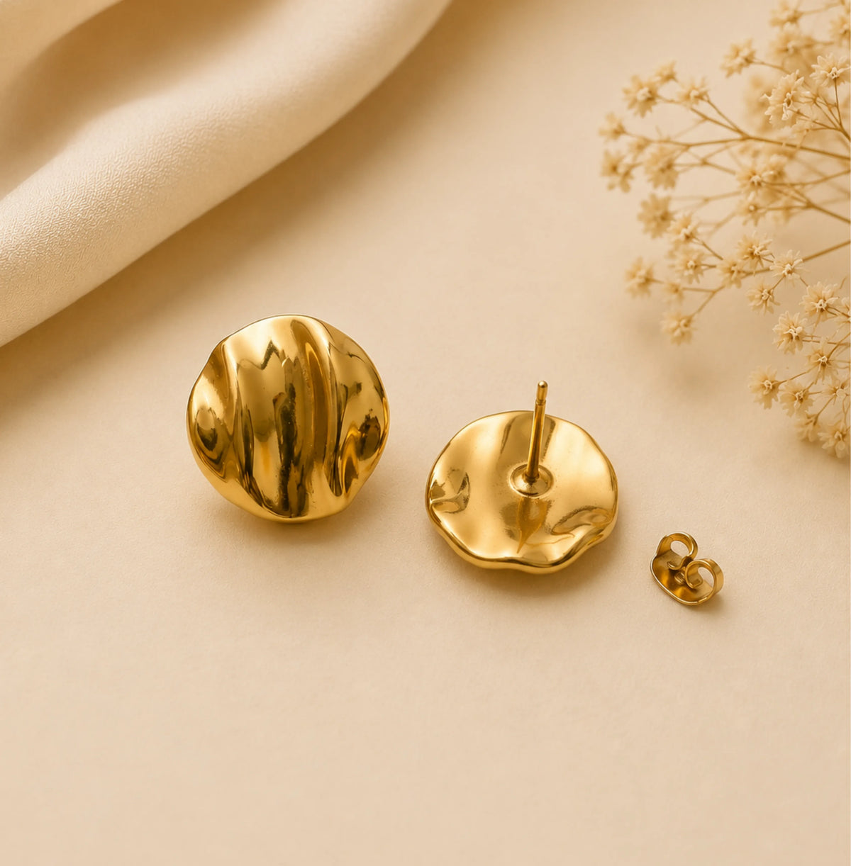 Pair of polished gold-toned dome stud earrings with rippled detailing