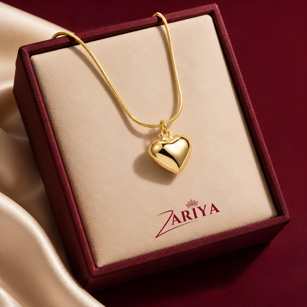 Puffy gold-finished heart pendant necklace by Zariya Official