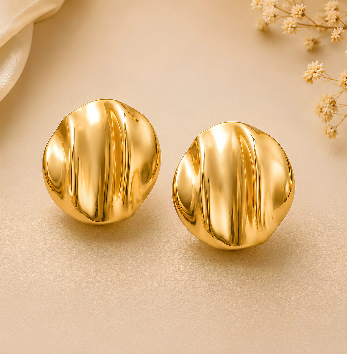 Gold-toned rippled dome stud earrings by Zariya Official